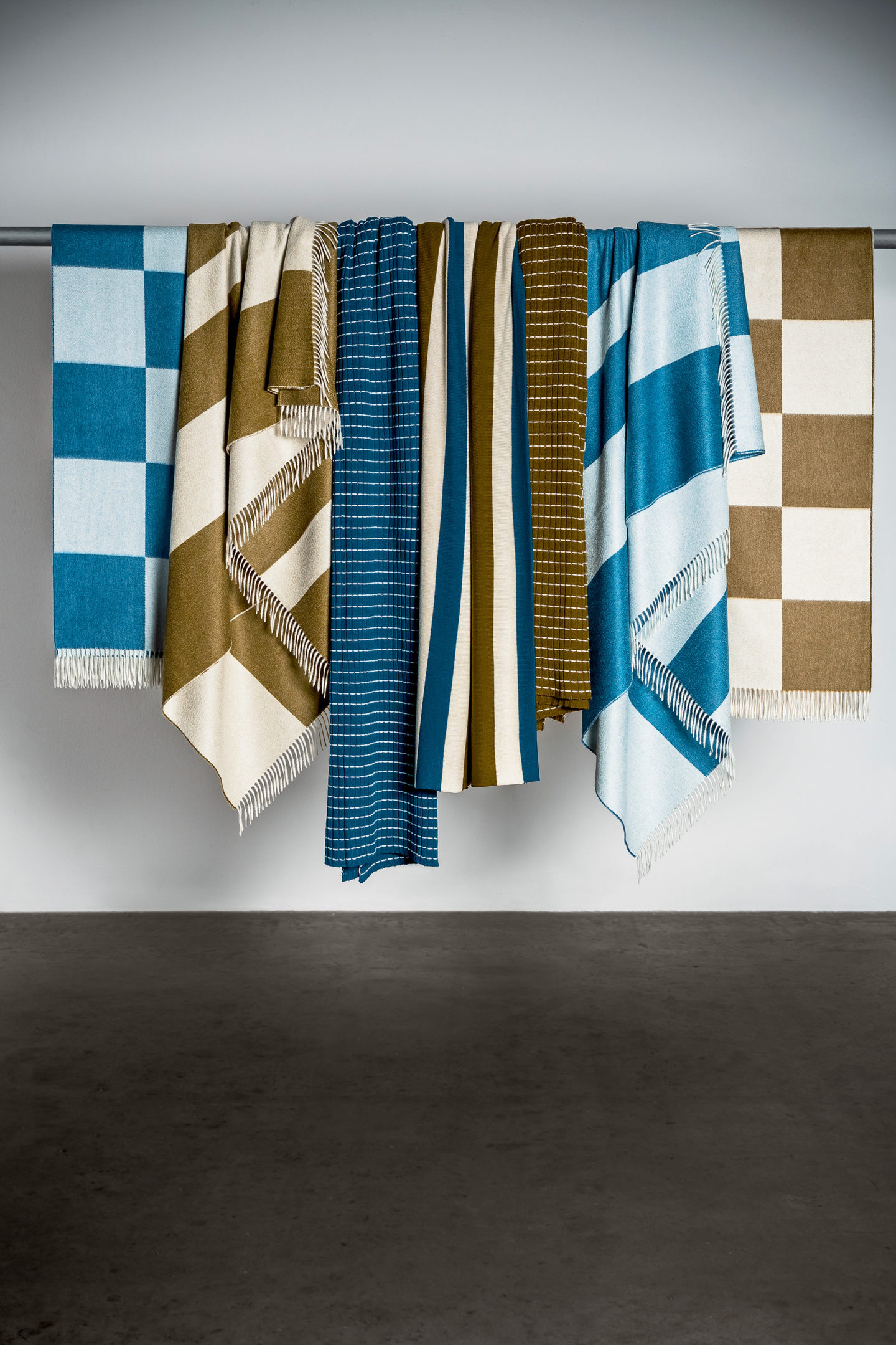 Masserano Cashmere throw hanging striped checked olive teal design styling