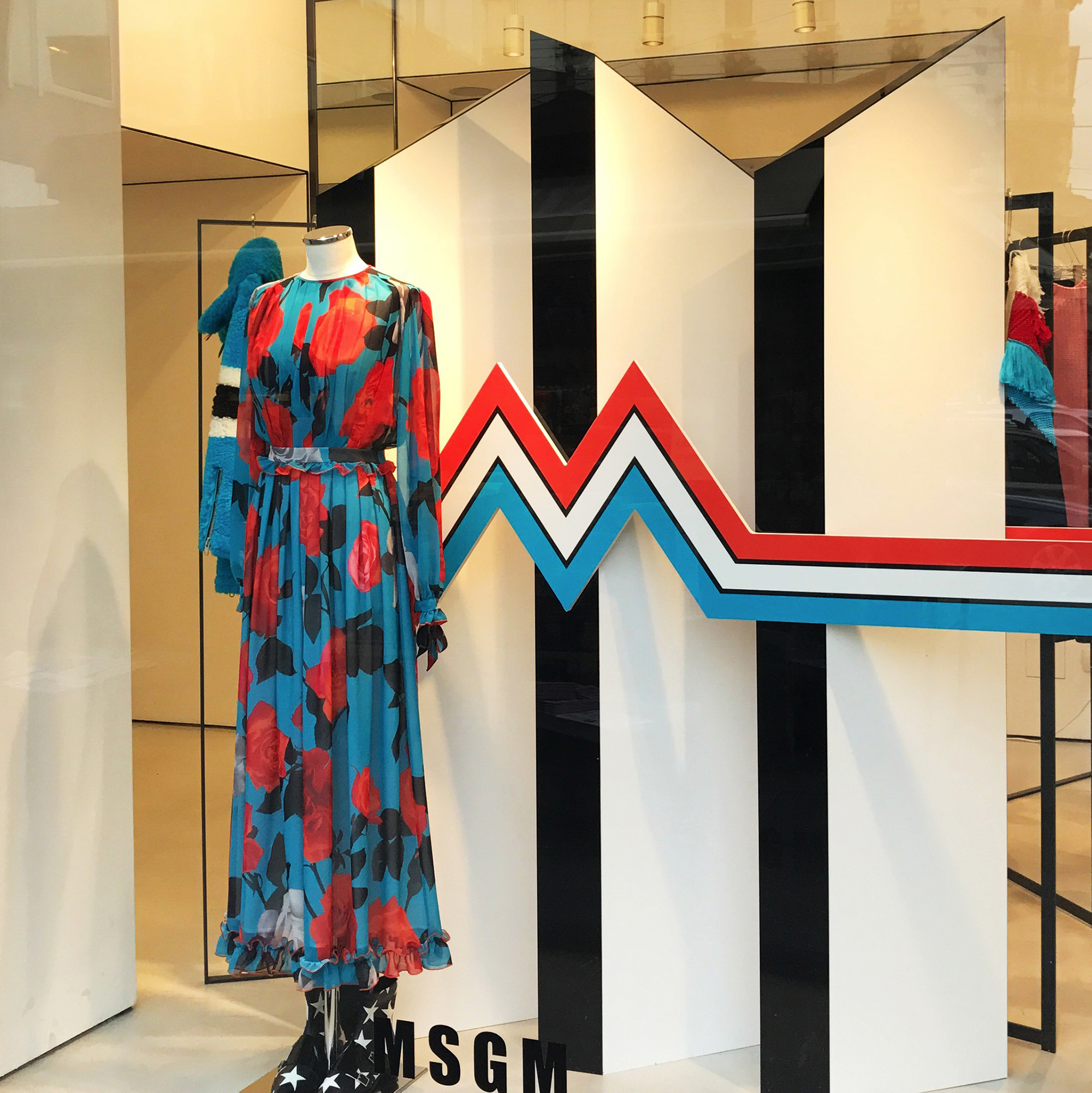 MSGM Twin Peaks M window design black and white structure, red flowers dress