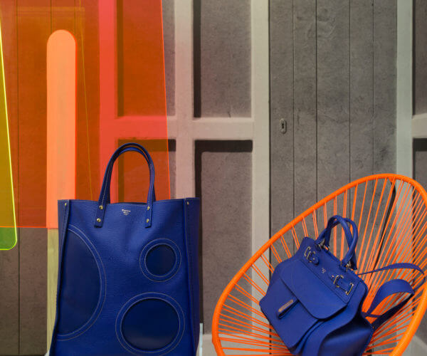 Fontana Milano 1915 electric blue bags, orange chair and fluo popsicles