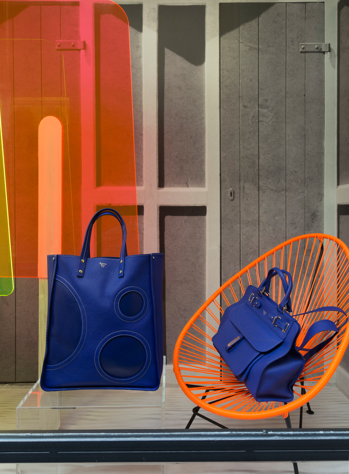 Fontana Milano 1915 electric blue bags, orange chair and fluo popsicles