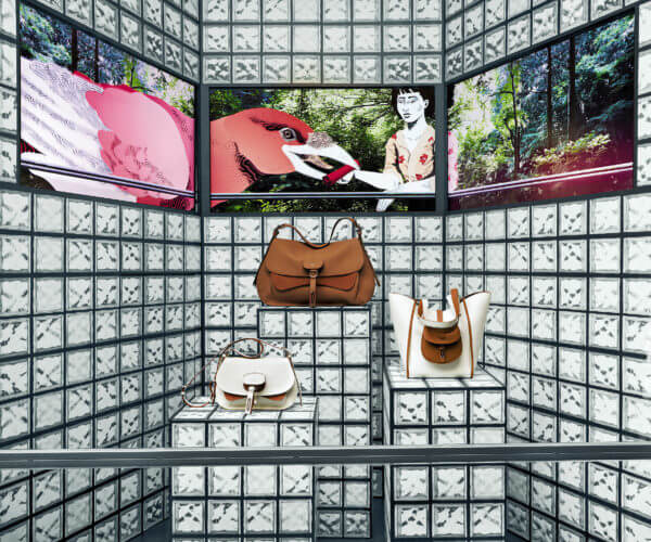 Fontana Milano 1915 bags window display with video and printed glass blocks