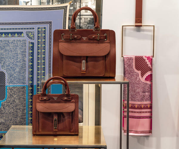 Fontana Milano handbags and scarfs, brass window display