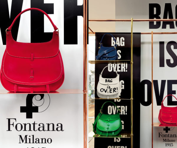 Fontana Milano 1915 red and green bag, brass window display design