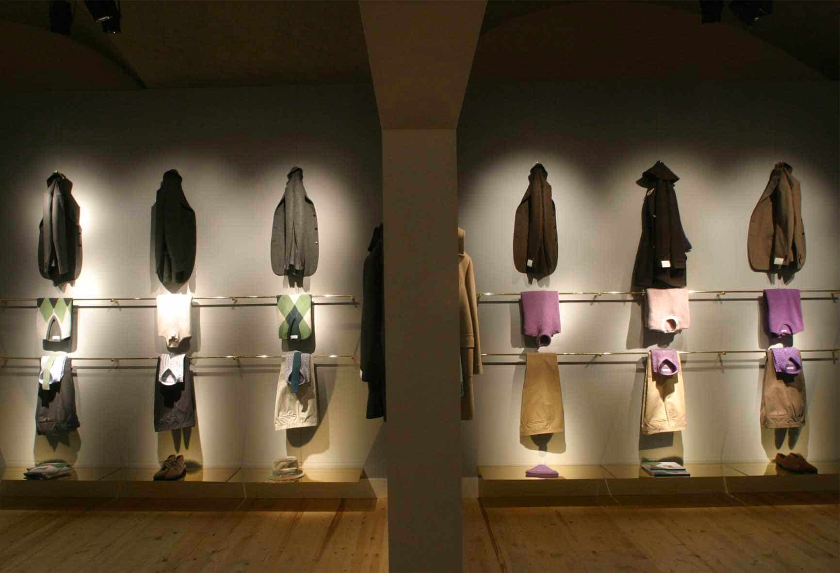 Ballantyne Pitti: hanging cashmere sweaters, grey and brass
