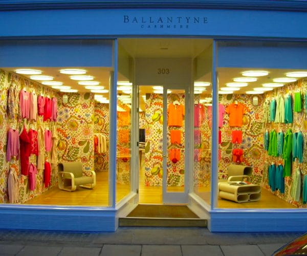 Ballantyne window display design with cashmere sweaters, wallpaper, colors